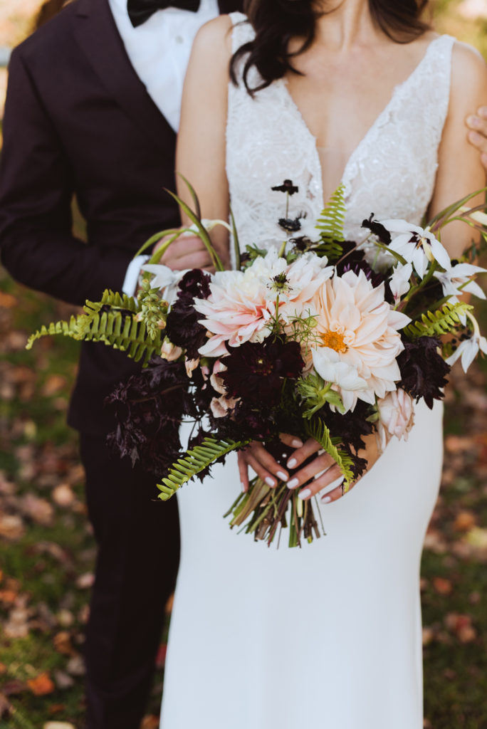 bride holding fall inspired bouquet