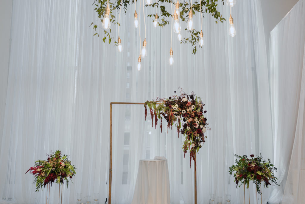 copper arch with florals ceremony decor at ottawa art gallery wedding