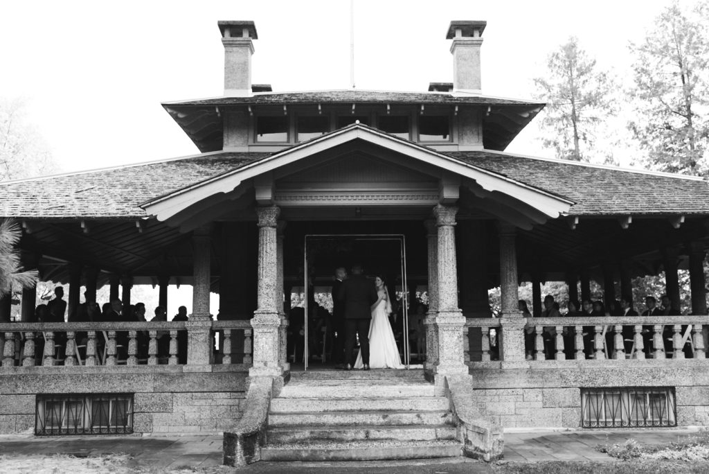 wedding ceremony underneath rockcliffe pavilion on a rainy day