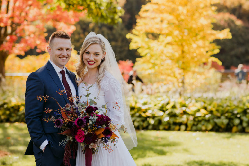 bride and groom in majors hill park during fall wedding