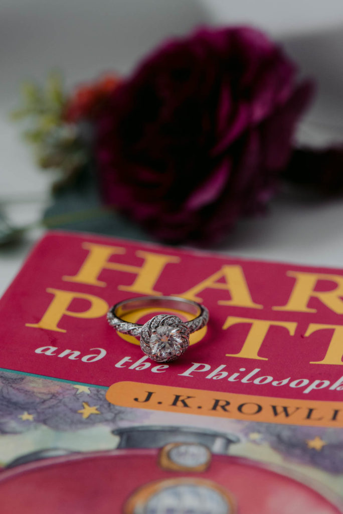 engagement ring on harry potter book