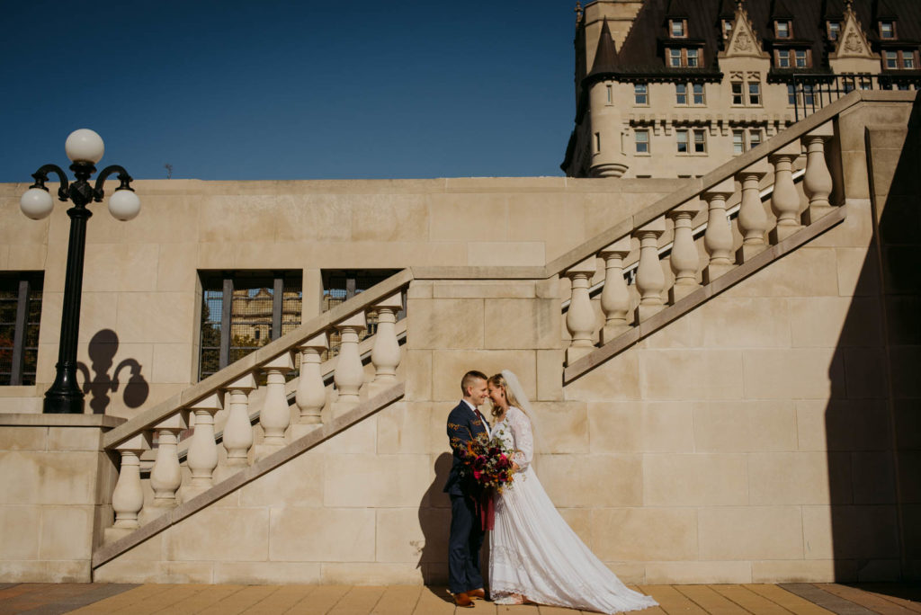 bride and groom outside chateau laurier