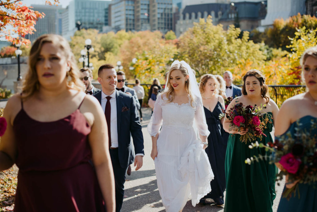 wedding party walking around downtown Ottawa during fall wedding