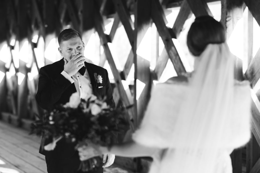 groom seeing the bride for the first time on the wakefield covered bridge in wakefield