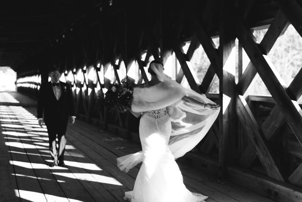 bride and groom first look on the wakefield covered bridge