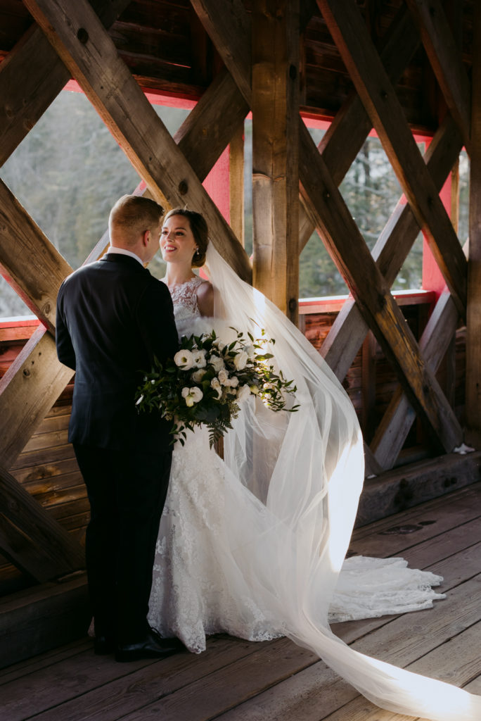 bride and groom on the wakefield covered bridge