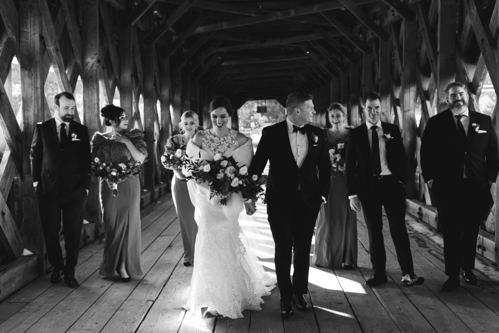 wedding party walking on the wakefield covered bridge