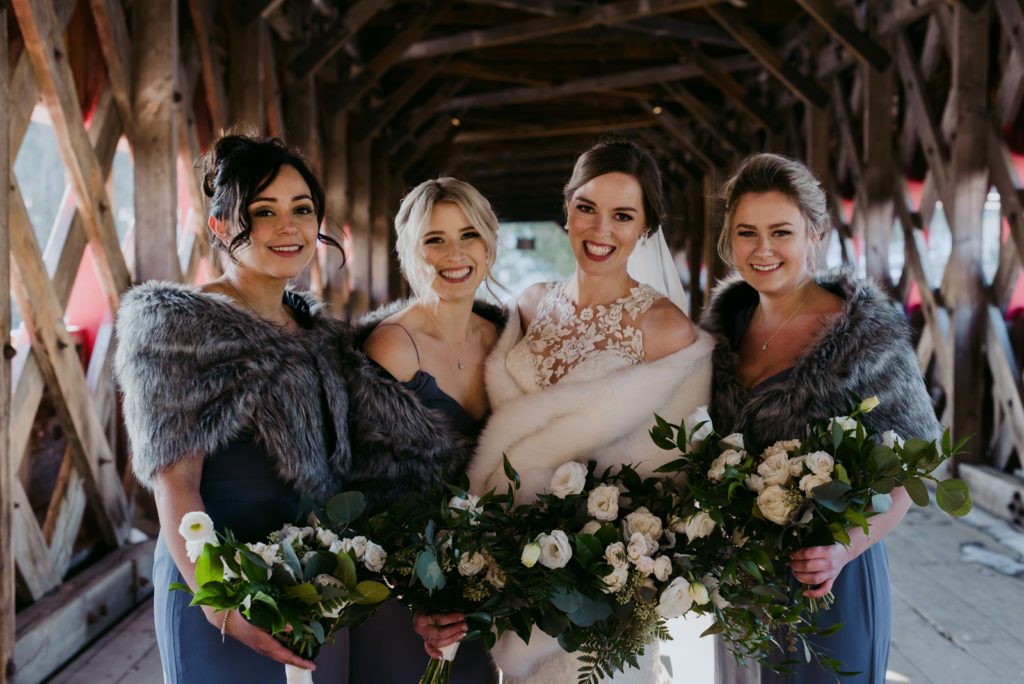 bridal party on the wakefield covered bridge in blue