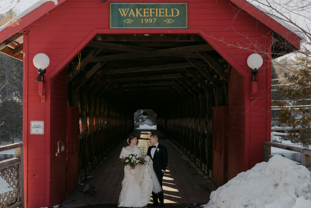 bride and groom on the wakefield covered bridge