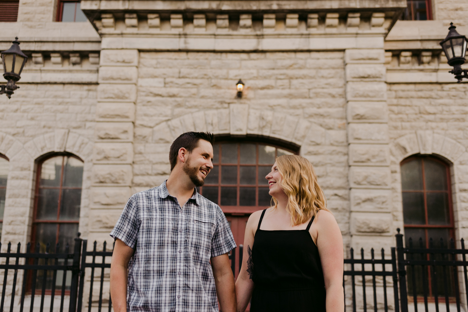 engaged couple in front of the pumphouse in ottawa