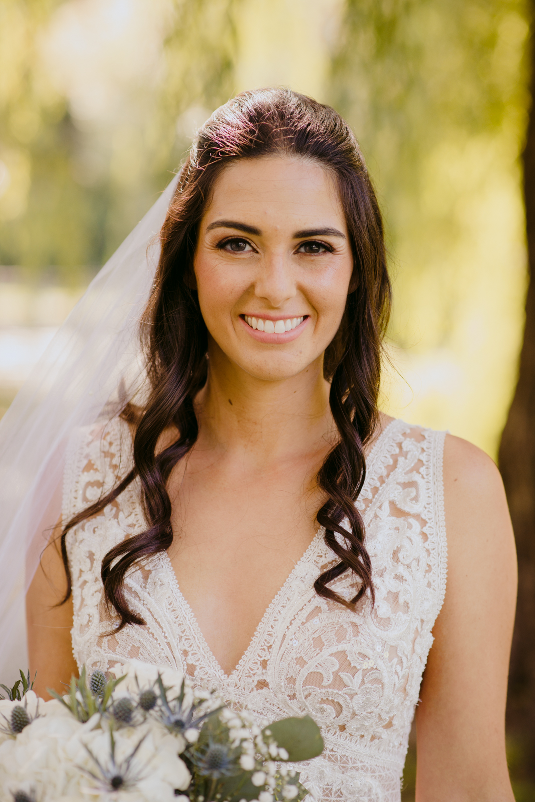 bride smiling at the camera by patterson's creek
