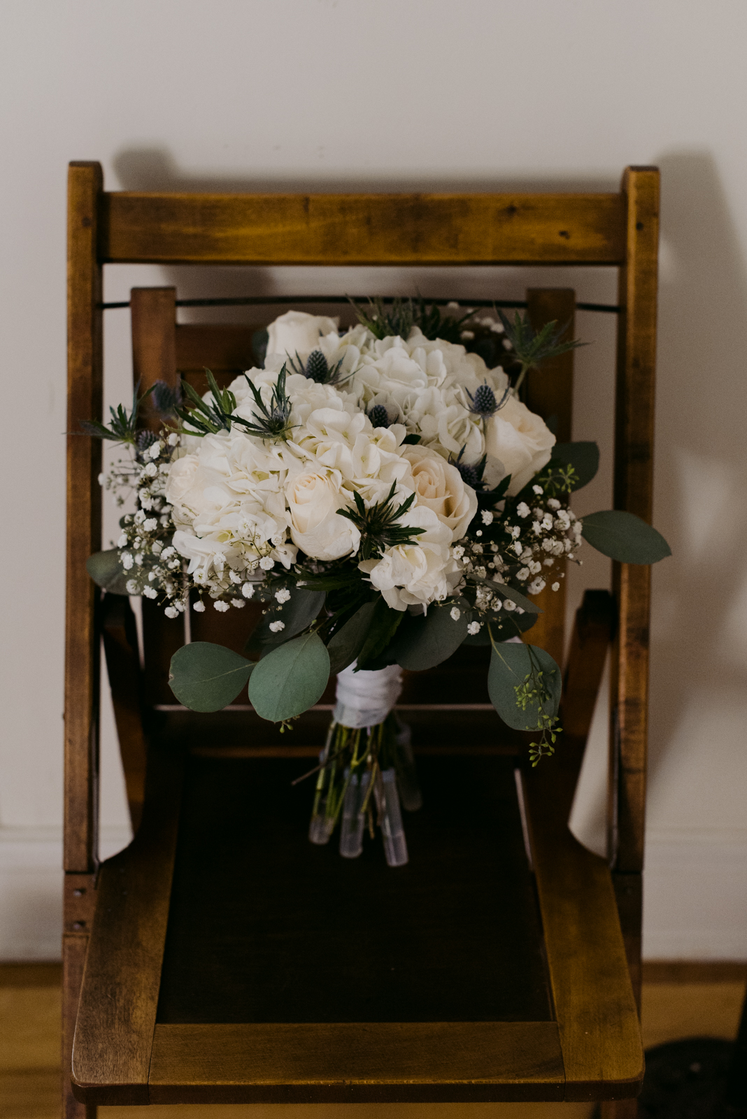 wedding bouquet on vintage wooden chair