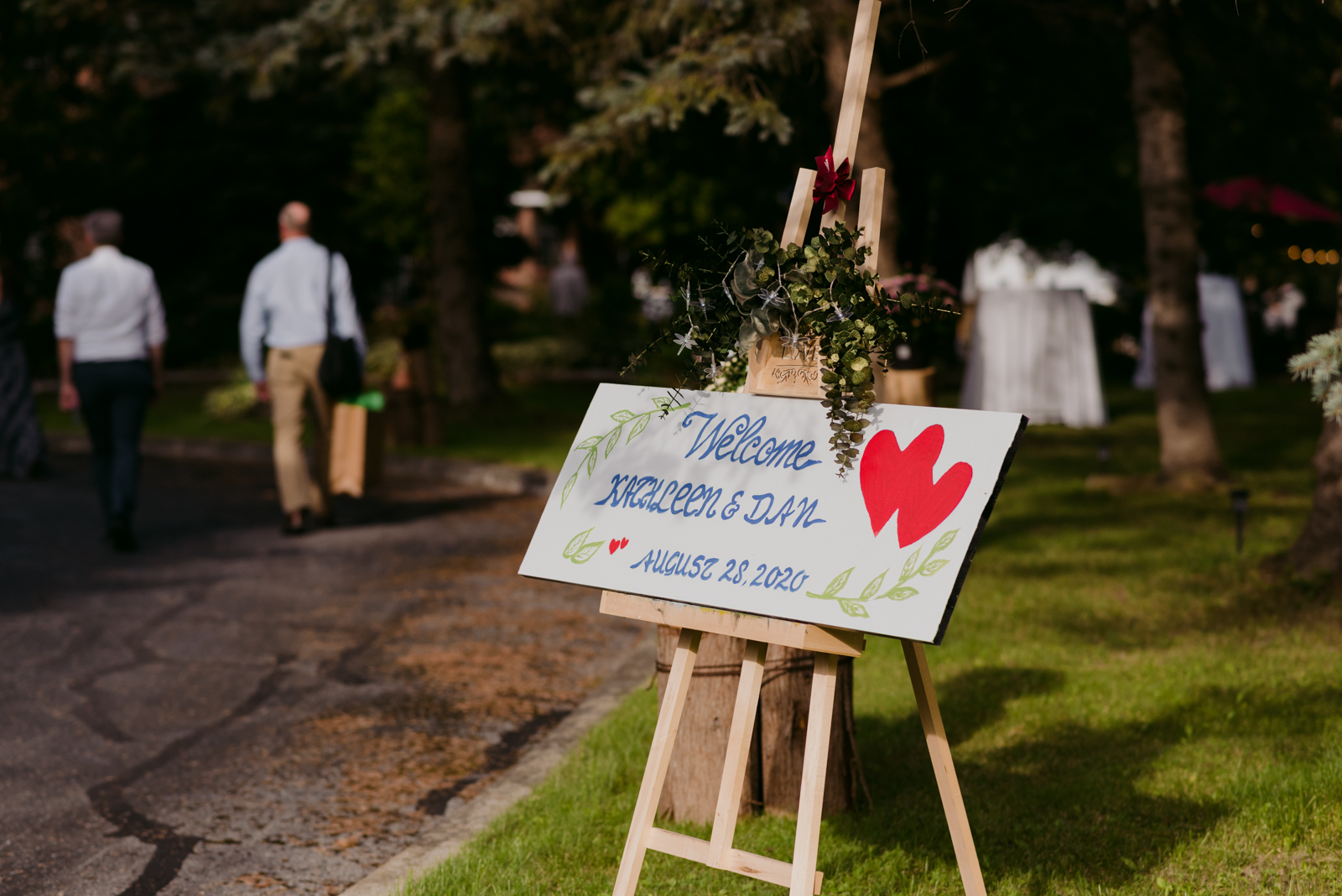 DIY welcome sign at backyard wedding reception