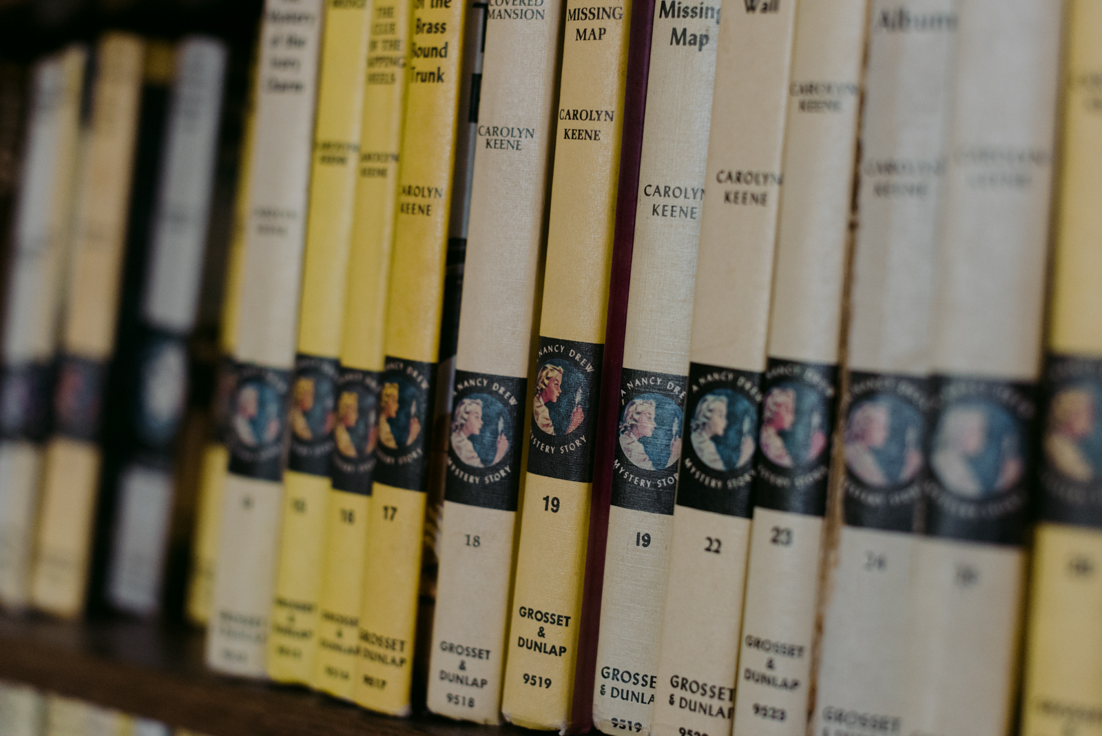 Vintage Nancy Drew novels on a bookshelf