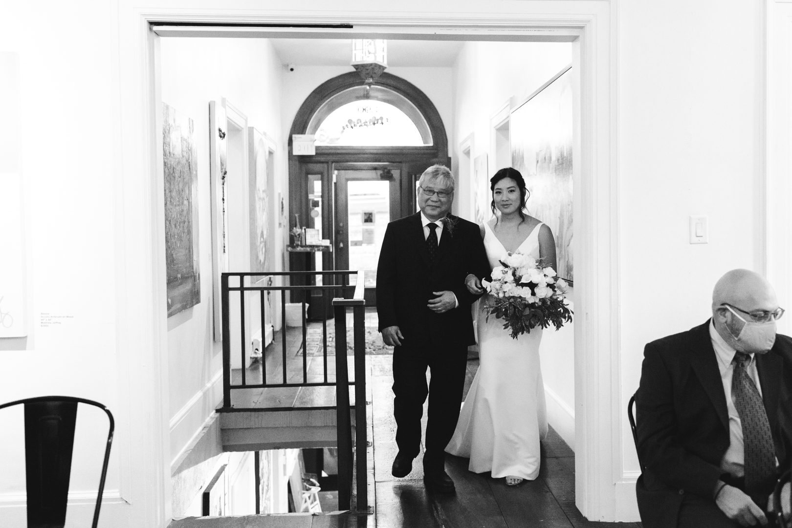 bride walking down the aisle with her father at Orange Art Gallery wedding