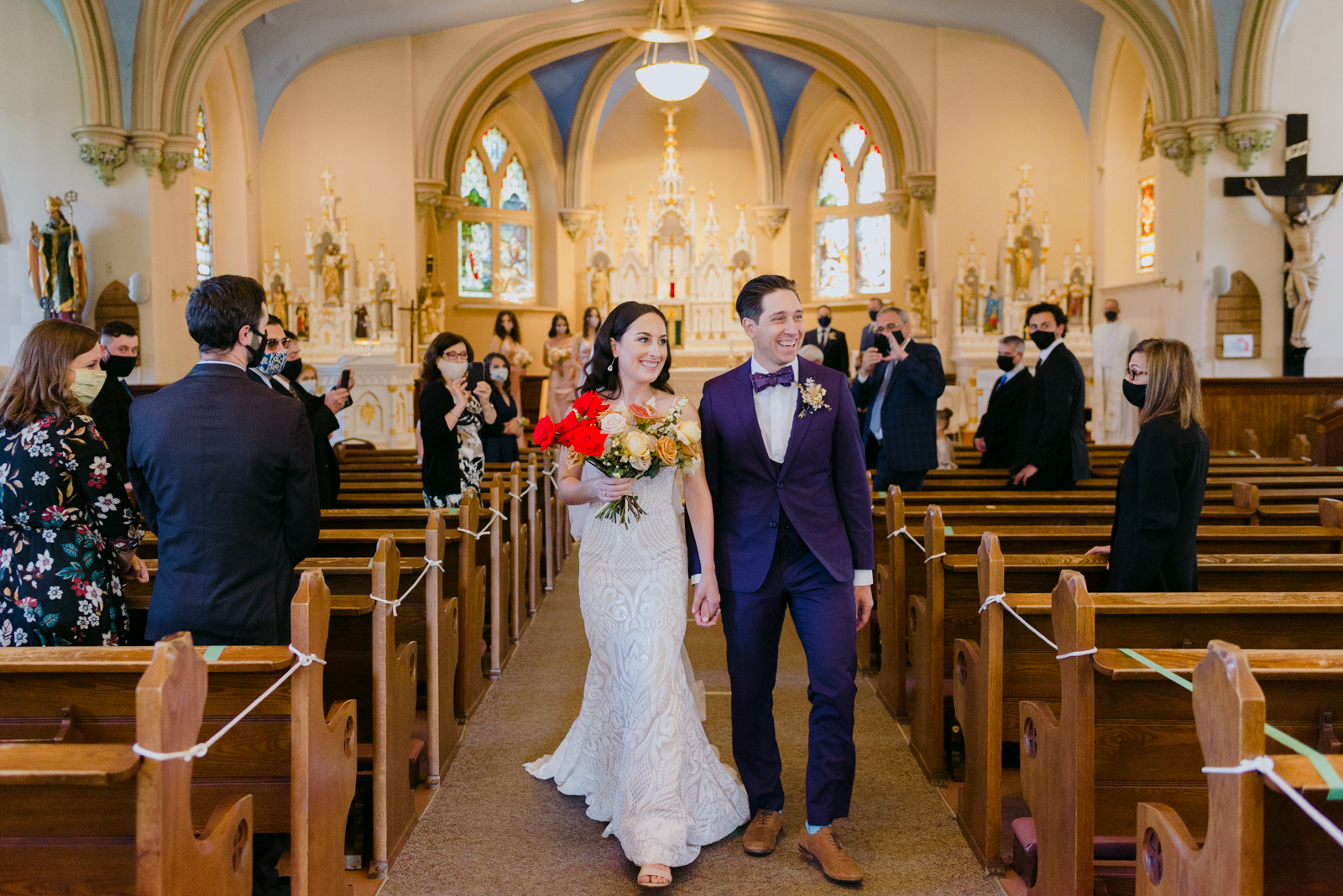 bride and groom recessional during church wedding ceremony