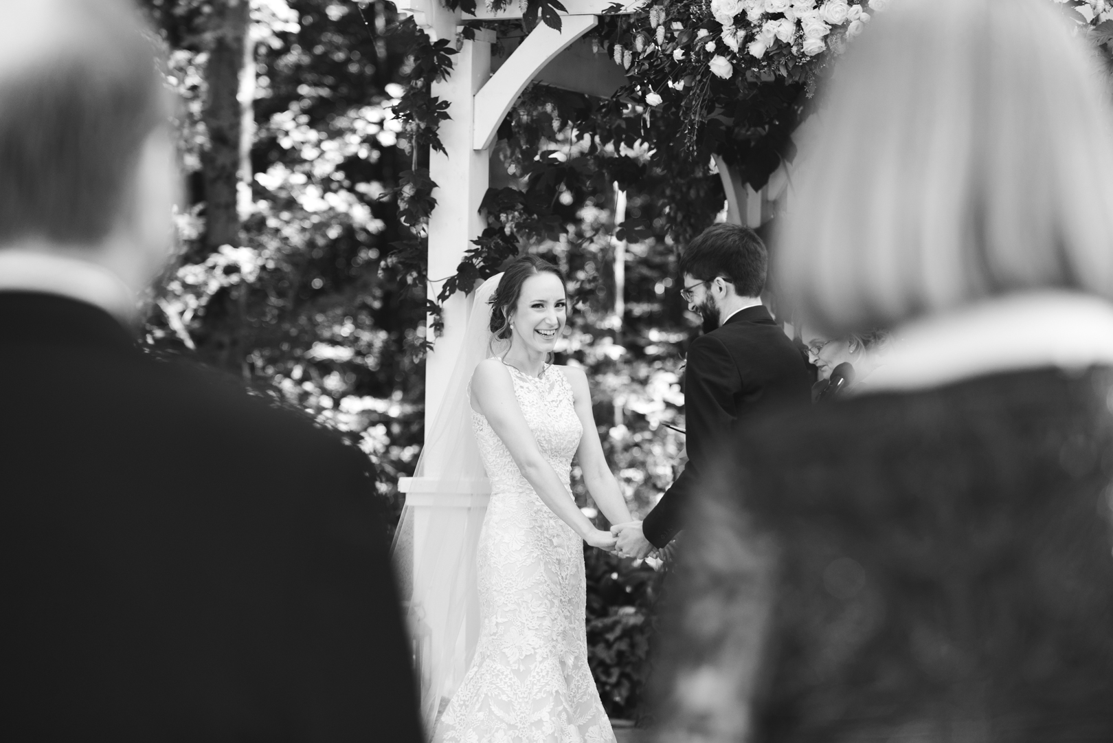 bride laughing during outdoor wedding ceremony