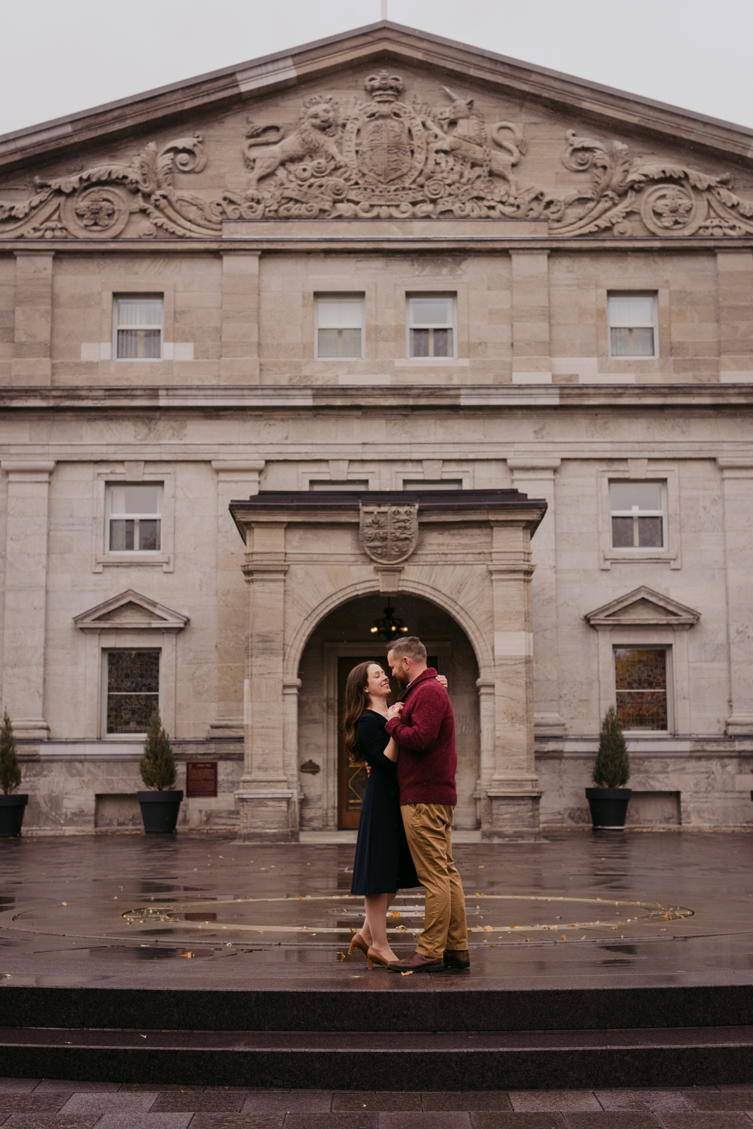 engaged couple slow dancing in front of rideau hall
