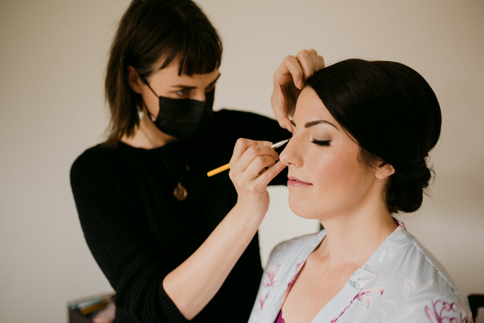 bride having her makeup done by lyz plant makeup artist