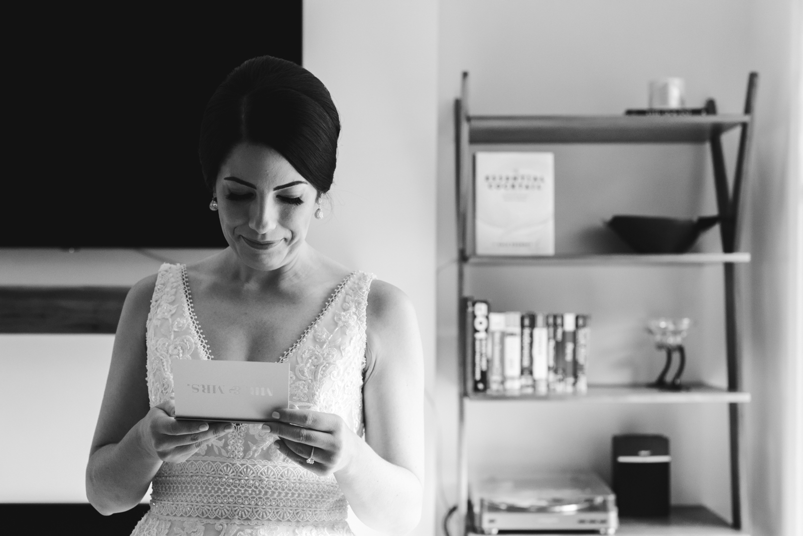 bride tearing up reading a letter from the groom