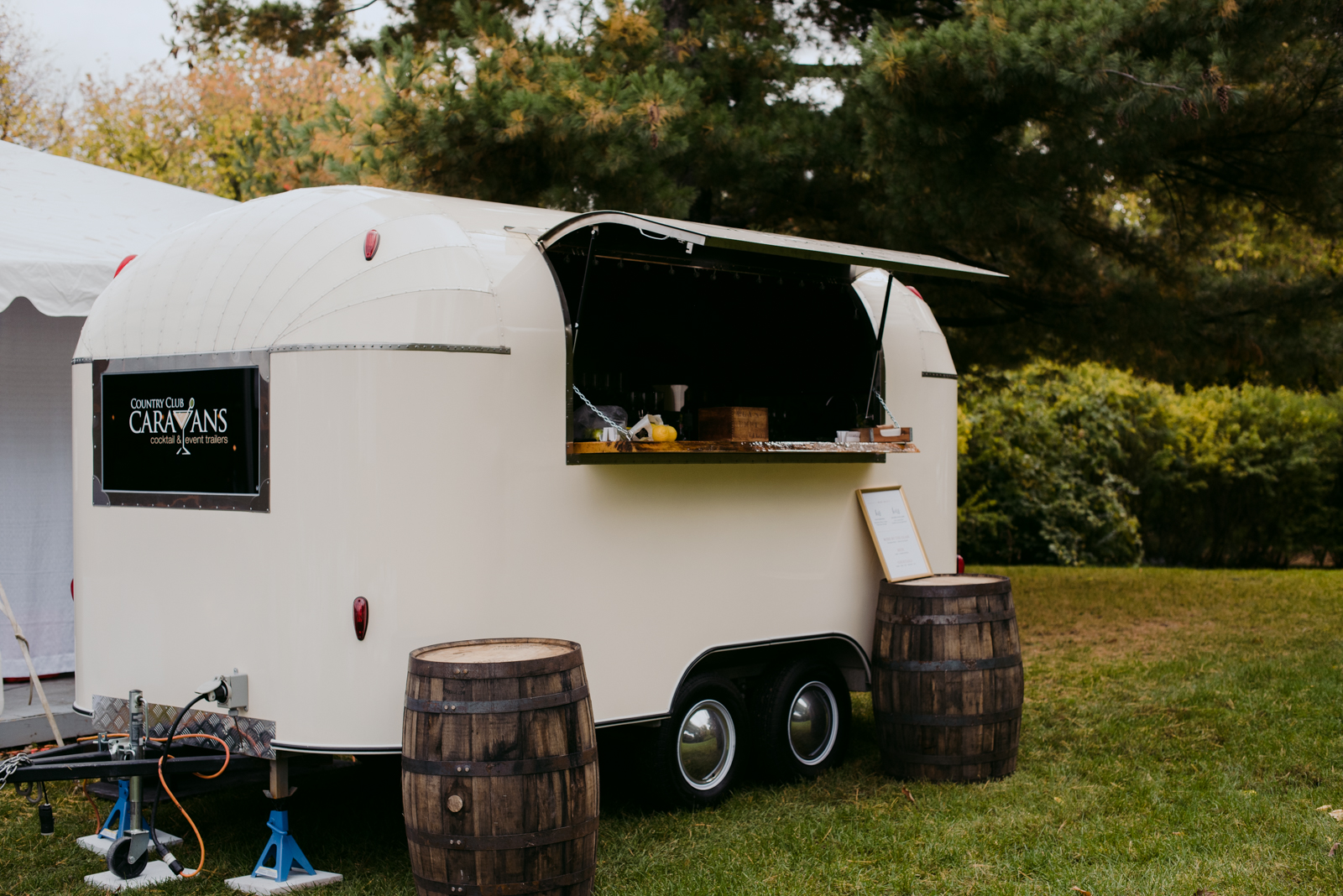 County caravan cocktail bar at outdoor wedding reception