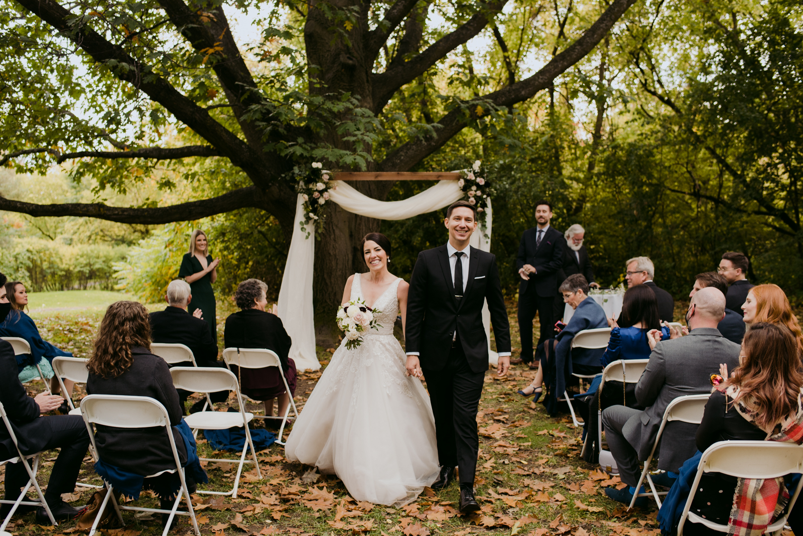 bride and groom recessional after outdoor wedding ceremony at billings estate
