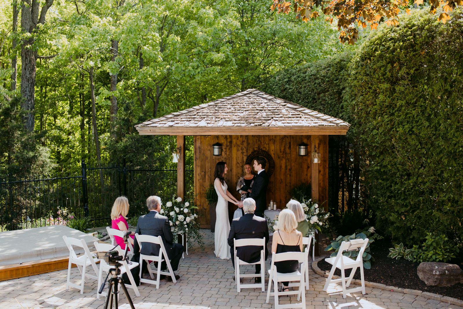 backyard summer wedding ceremony under pergola