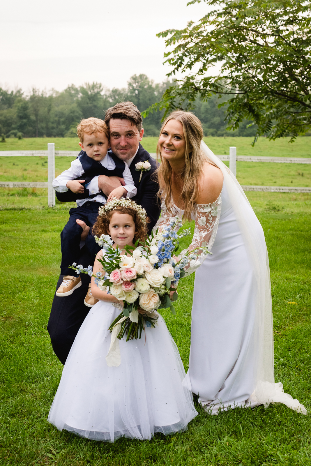 bride and groom with flower girl and ring bearer