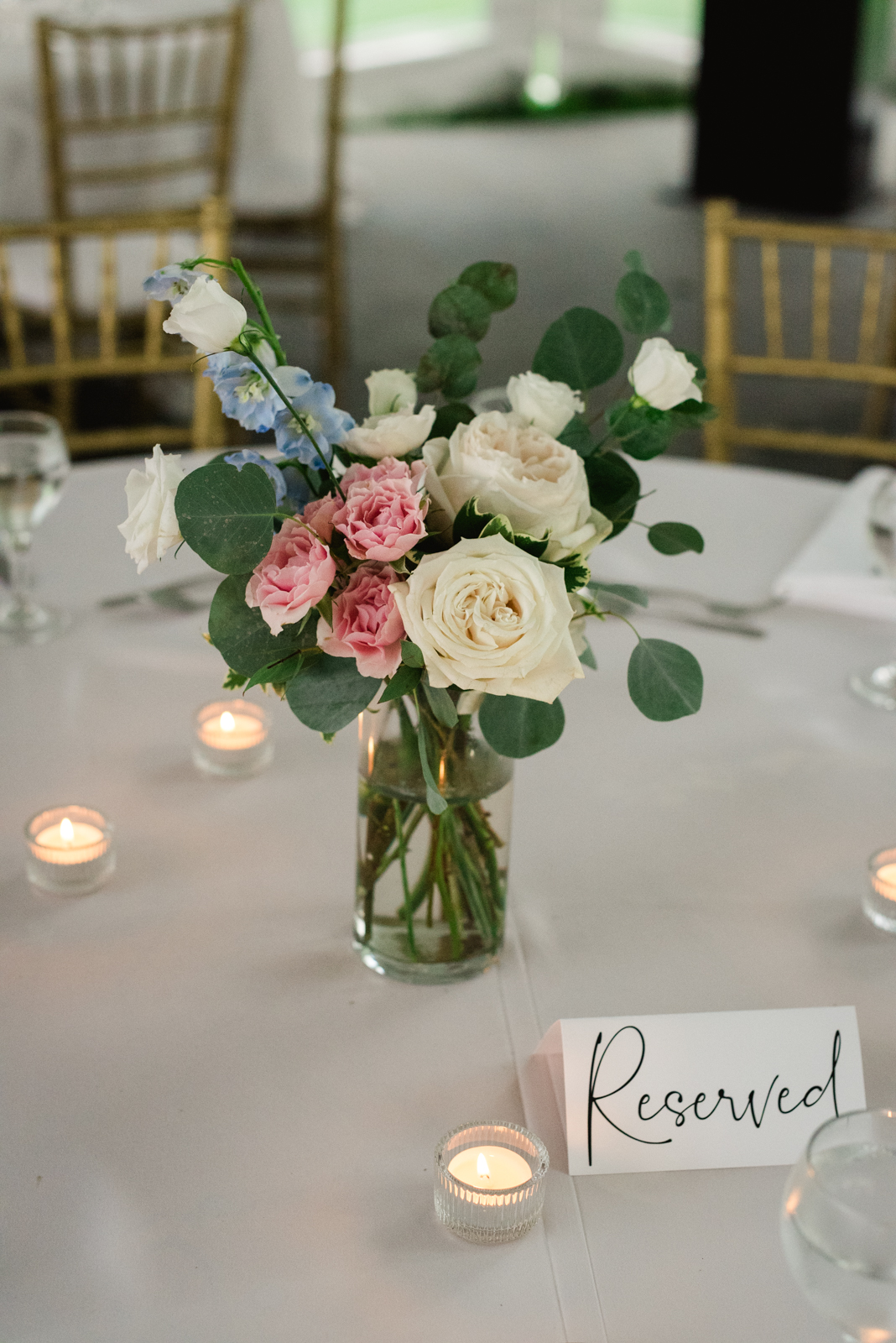 vase of flowers on table at wedding reception