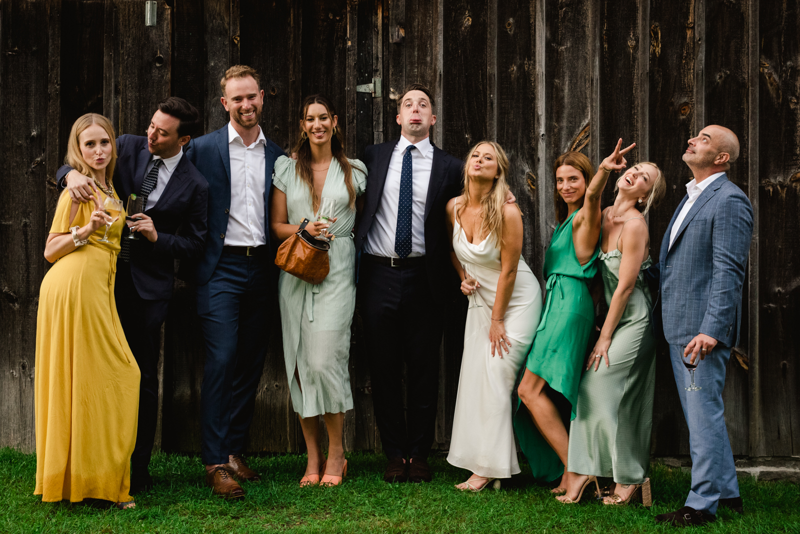 bride and groom with their friends making funny faces