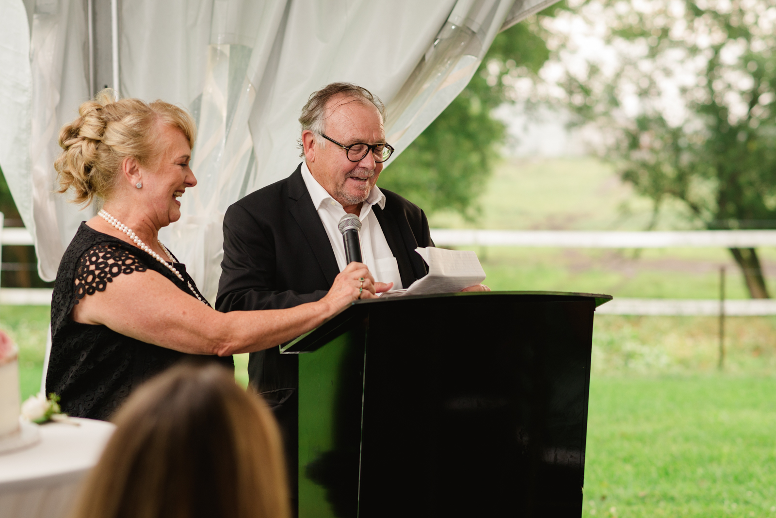 parents of the bride giving speech at wedding