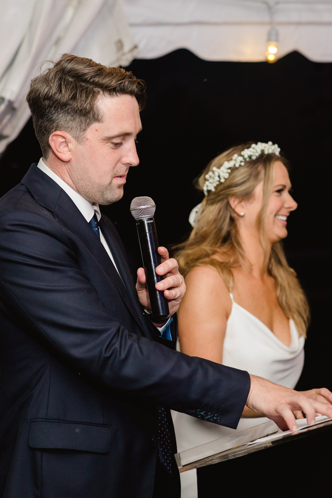 groom giving speech during wedding reception