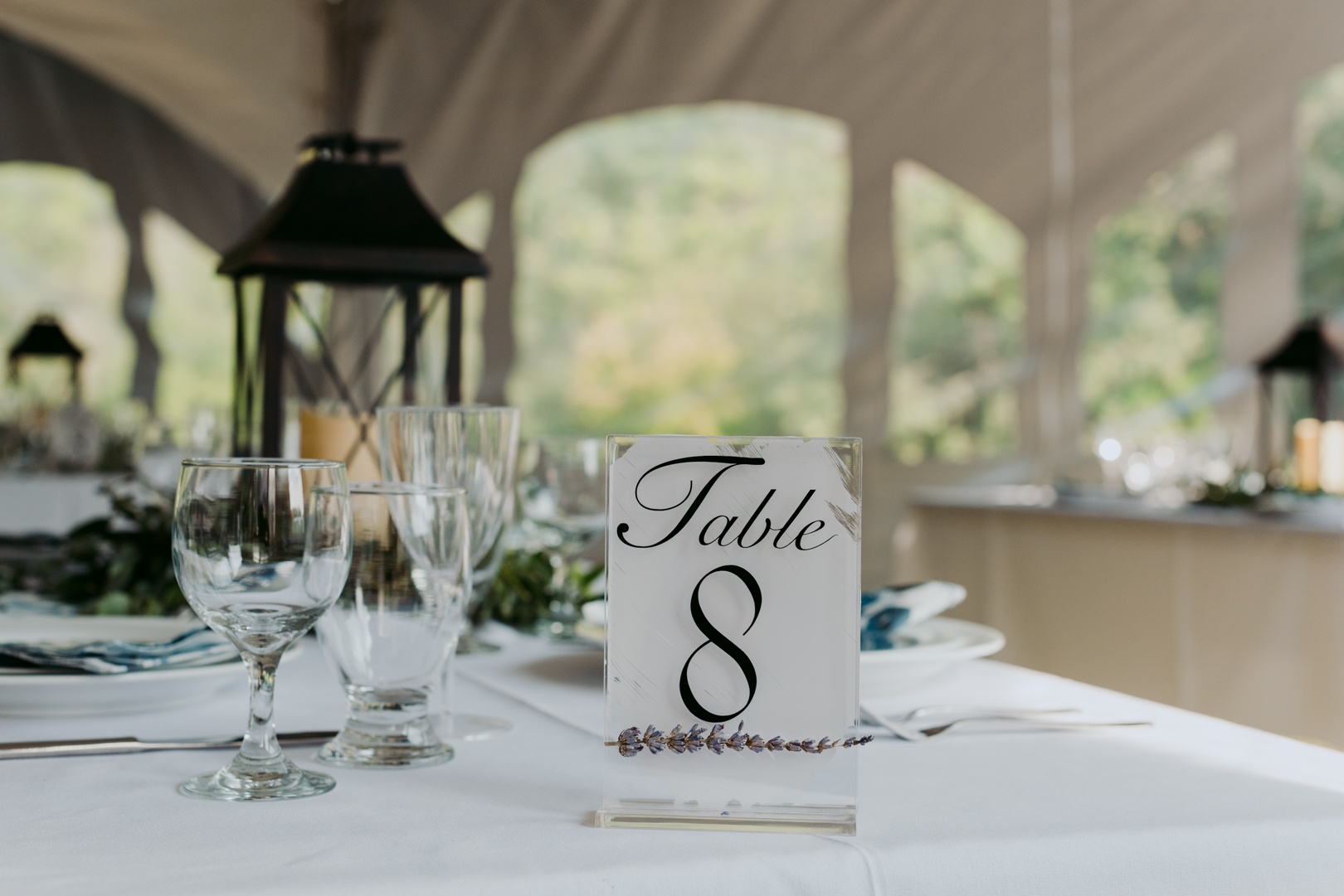 custom table number with lavender in tented wedding ceremony