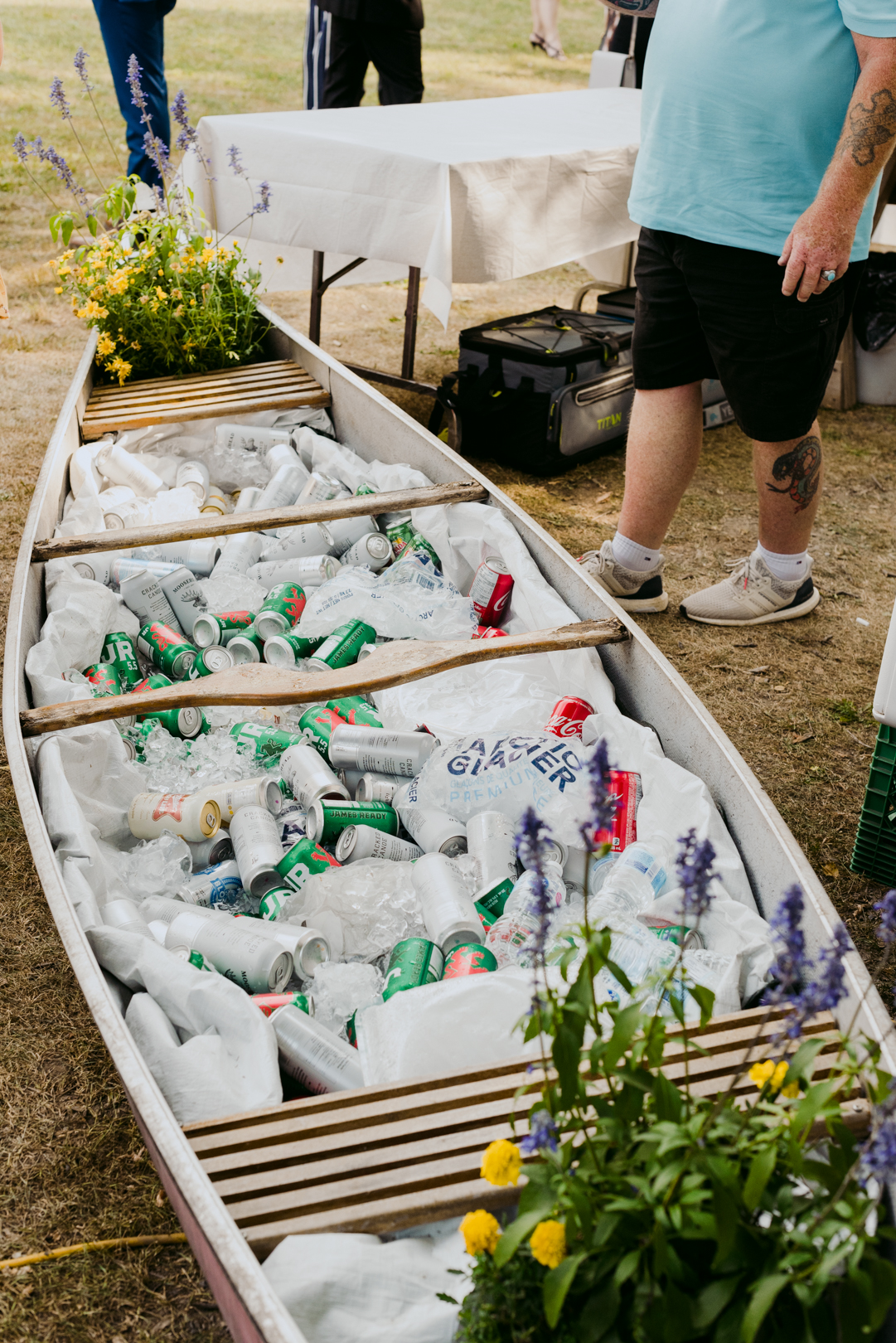 old canoe with beer and pop in it during outdoor wedding