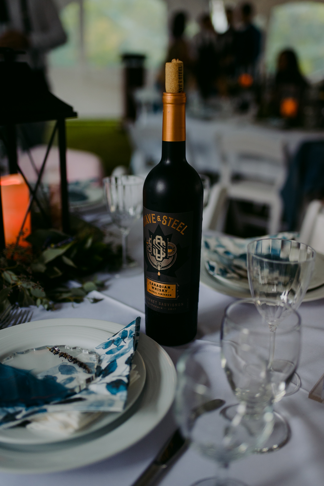 red wine on table at outdoor wedding