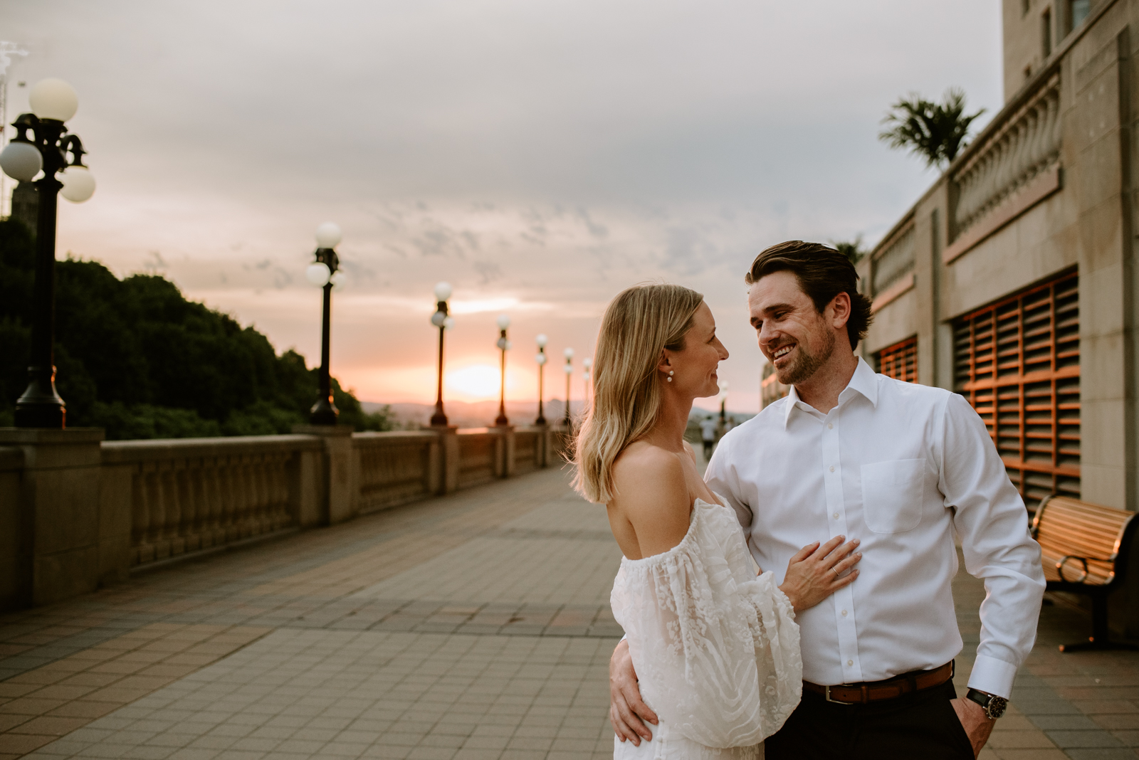 engaged couple on chateau laurier terrace at sunset