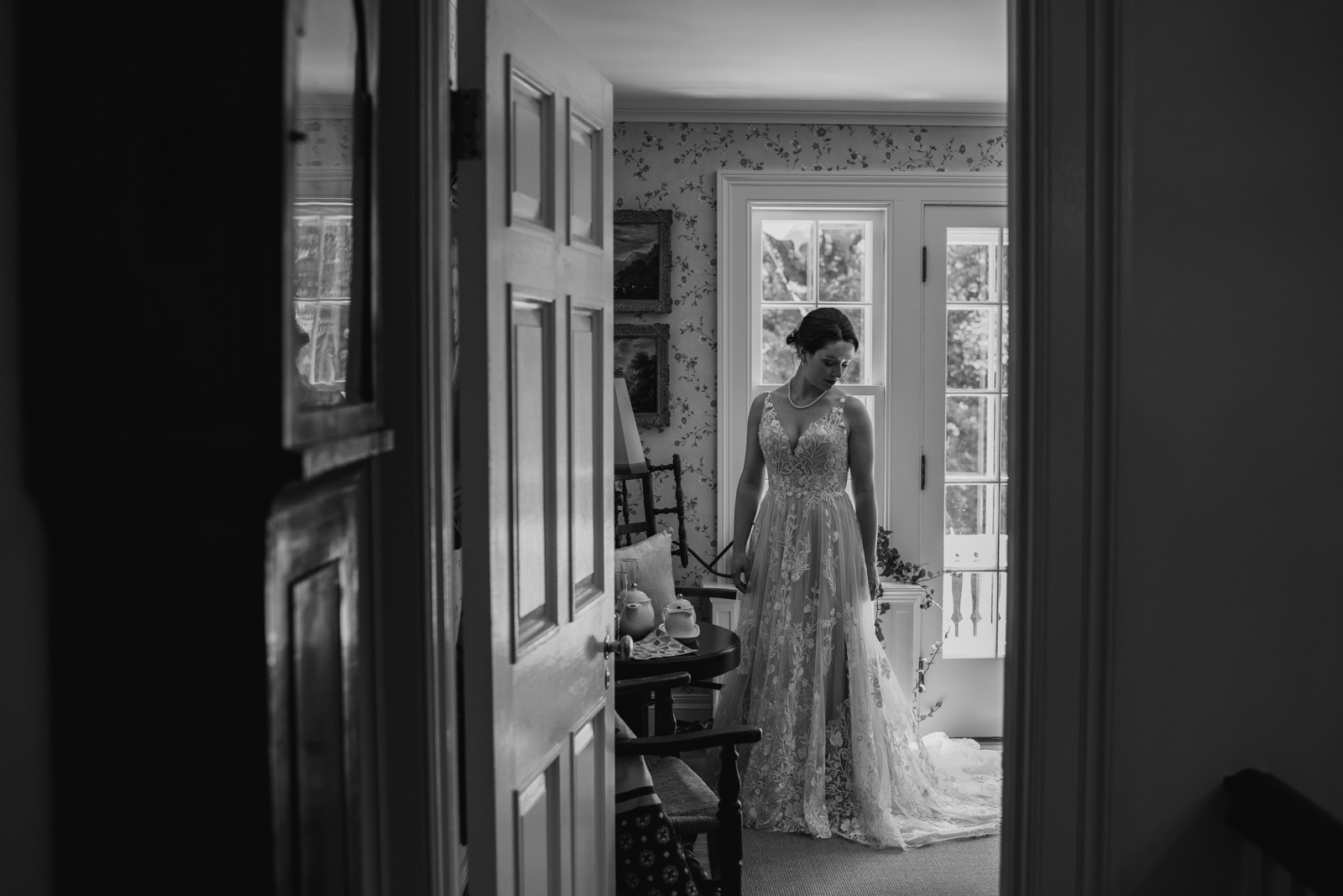 bride standing in women's study of private estate wedding