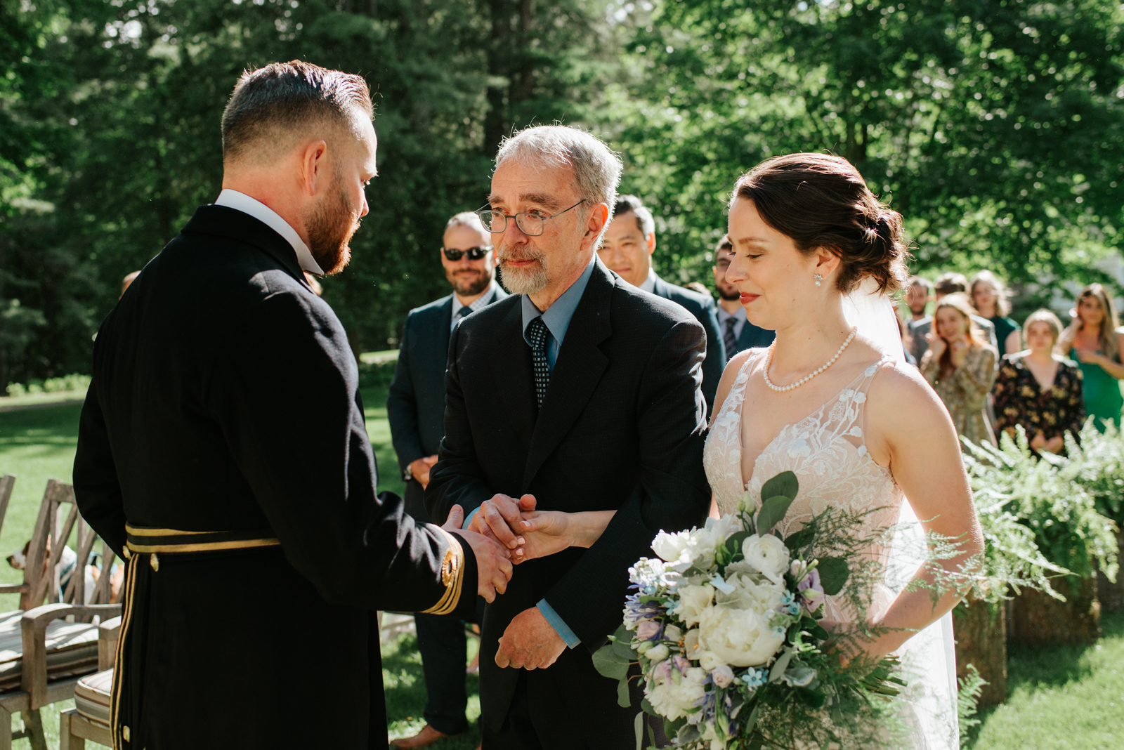 father of the bride giving away his daughter during wedding ceremony