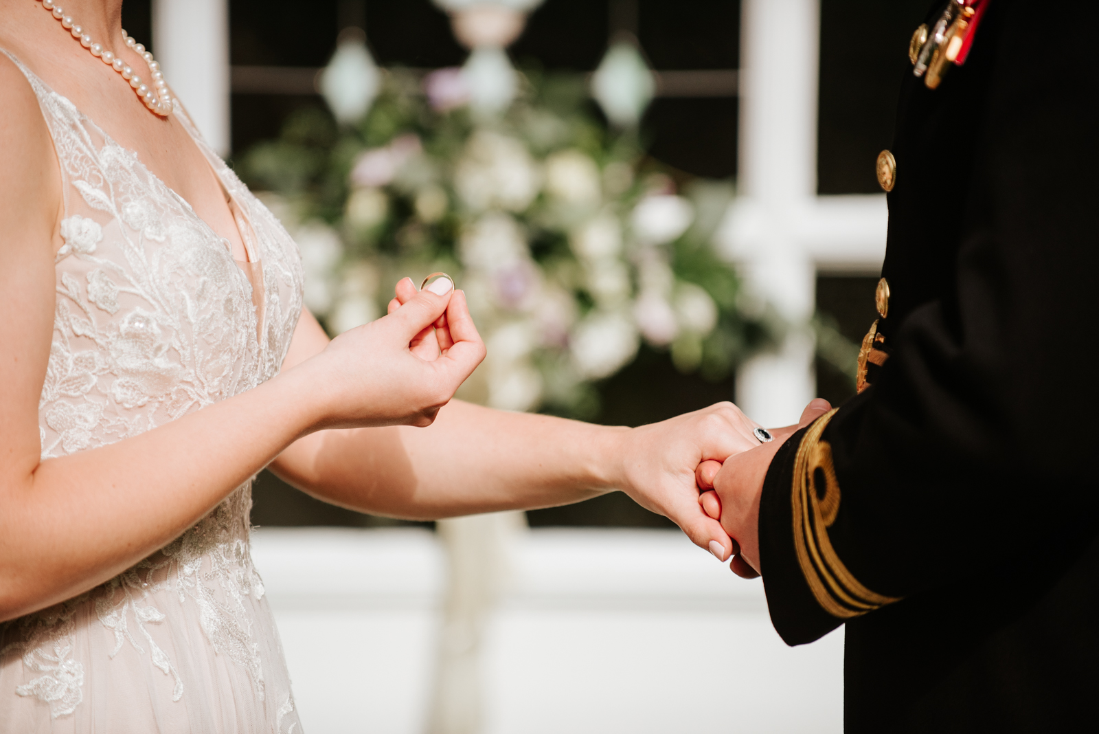 exchange of wedding rings during canadian navy wedding at private estate