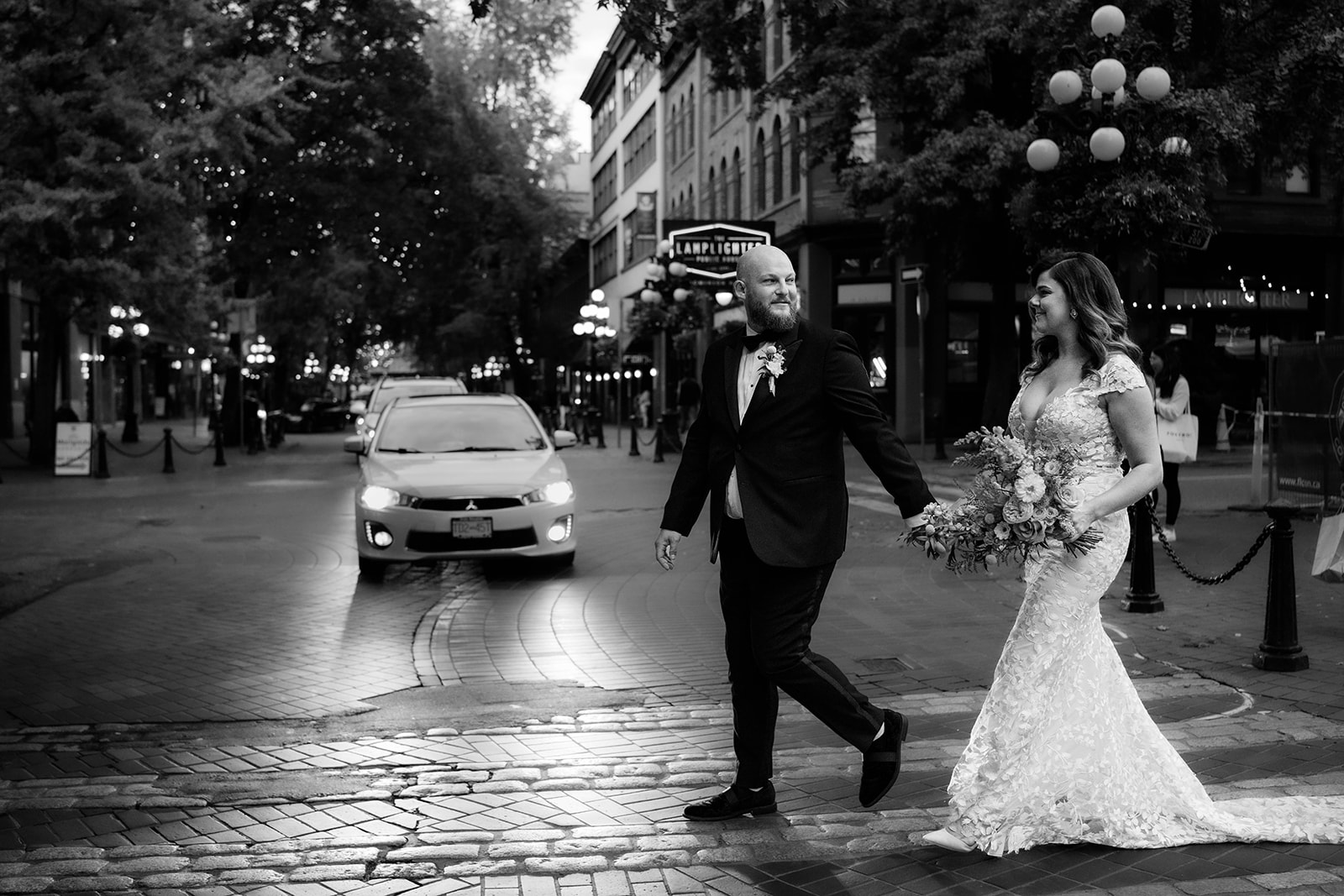 bride and groom walking down the street in Gastown Vancouver